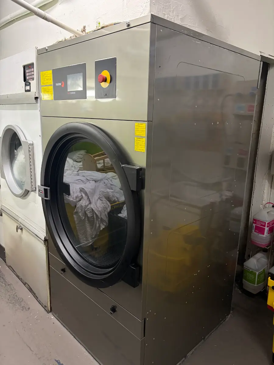 Commercial dryer repaired by MSA Appliance Repair in a hotel laundry in Miami Lakes Florida