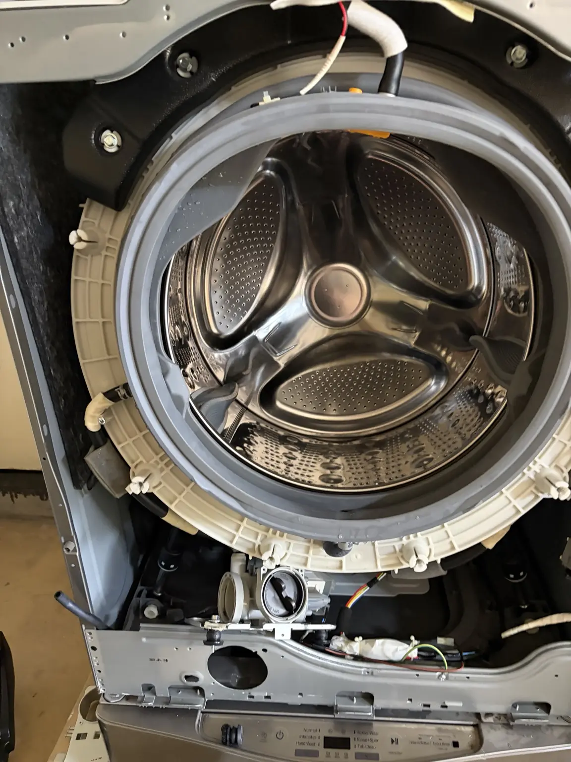 LG front-load washer opened for drain pump service in Tamarac Florida