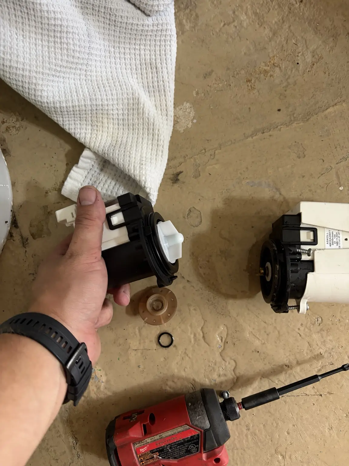 Replacement and failed LG washer drain pumps during repair in ZIP 33319
