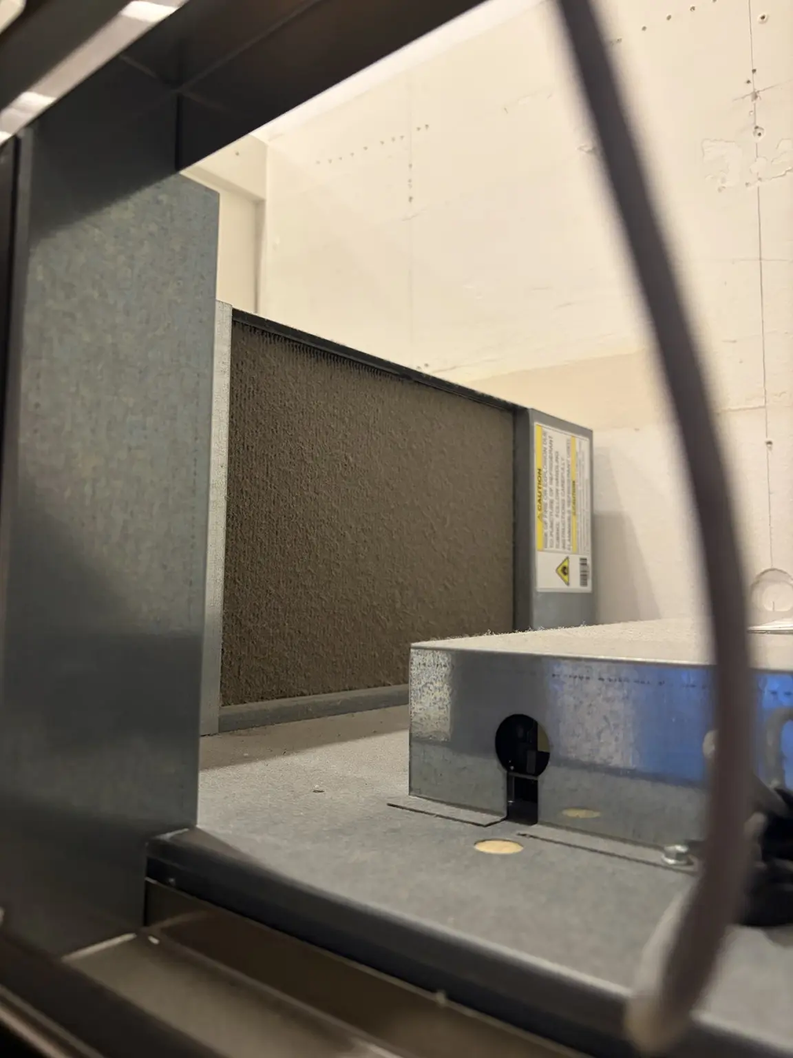 Clogged True refrigerator condenser coil before cleaning in Wellington Florida