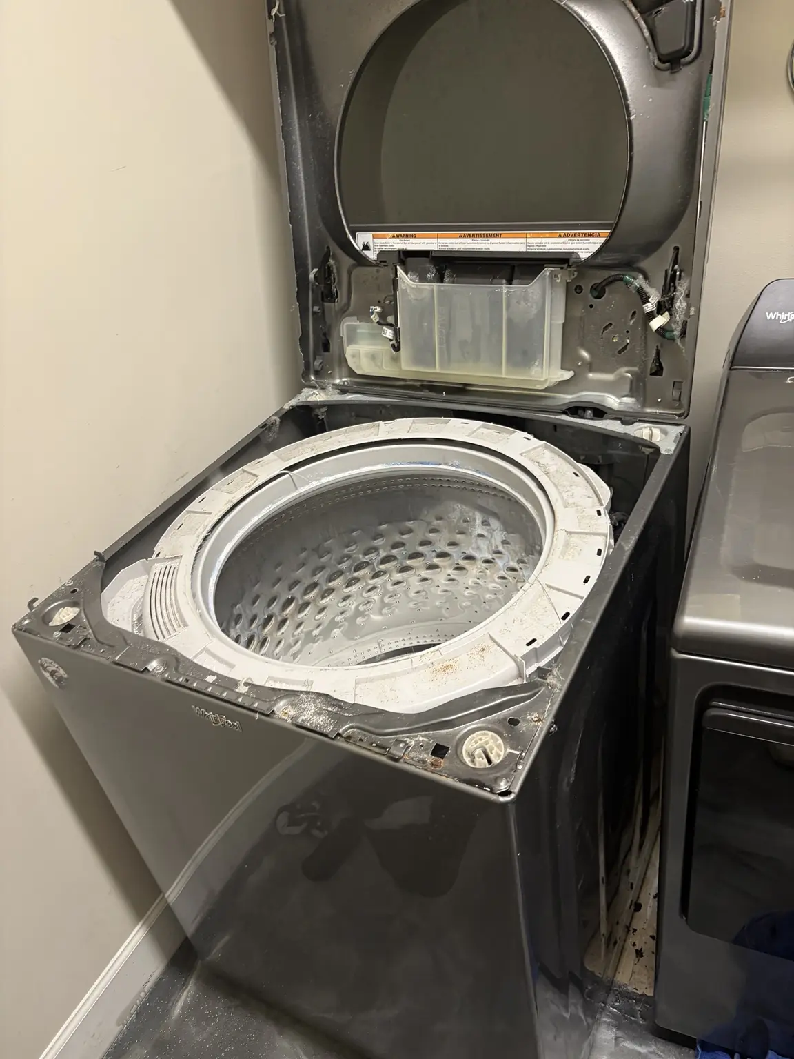 Whirlpool top-load washer opened for suspension rod replacement in Westlake Florida 33470